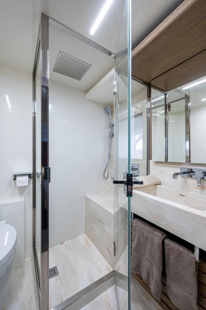 a bathroom with a glass shower aboard LEBRADA Yacht for Sale