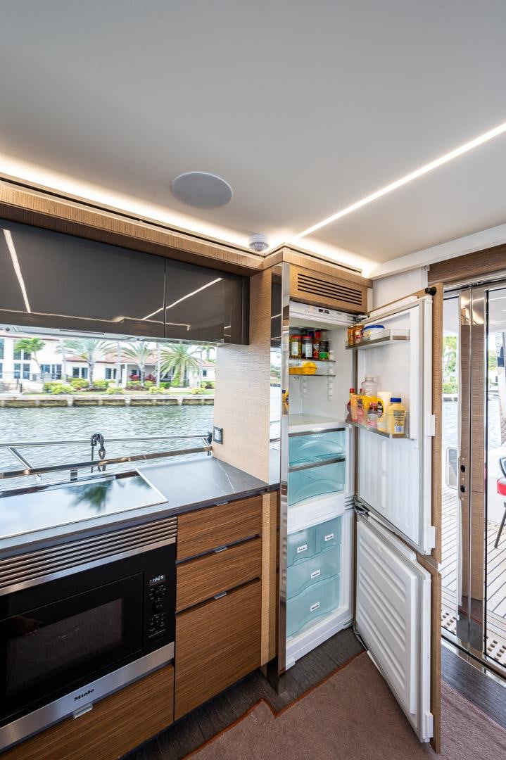 a kitchen with a sink and a refrigerator aboard LEBRADA Yacht for Sale