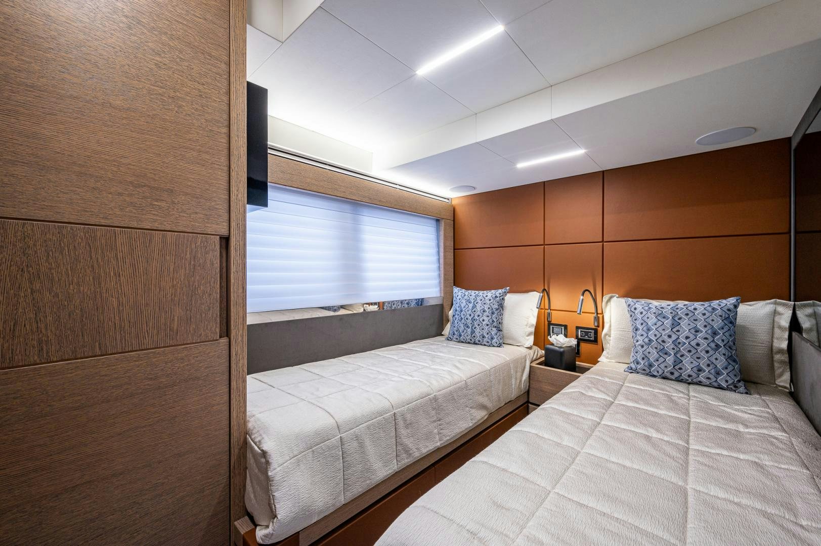a room with two beds aboard LEBRADA Yacht for Sale