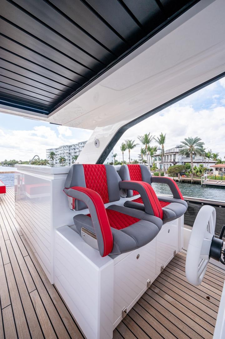 a deck with a deck and chairs aboard LEBRADA Yacht for Sale