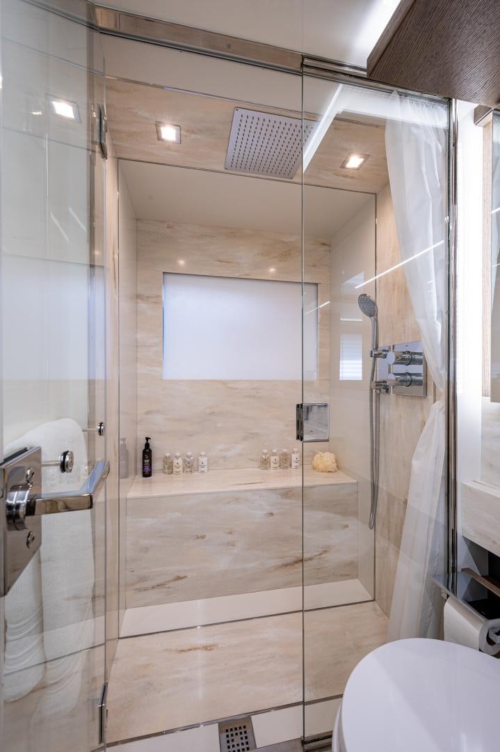 a shower unit with glass doors aboard LEBRADA Yacht for Sale