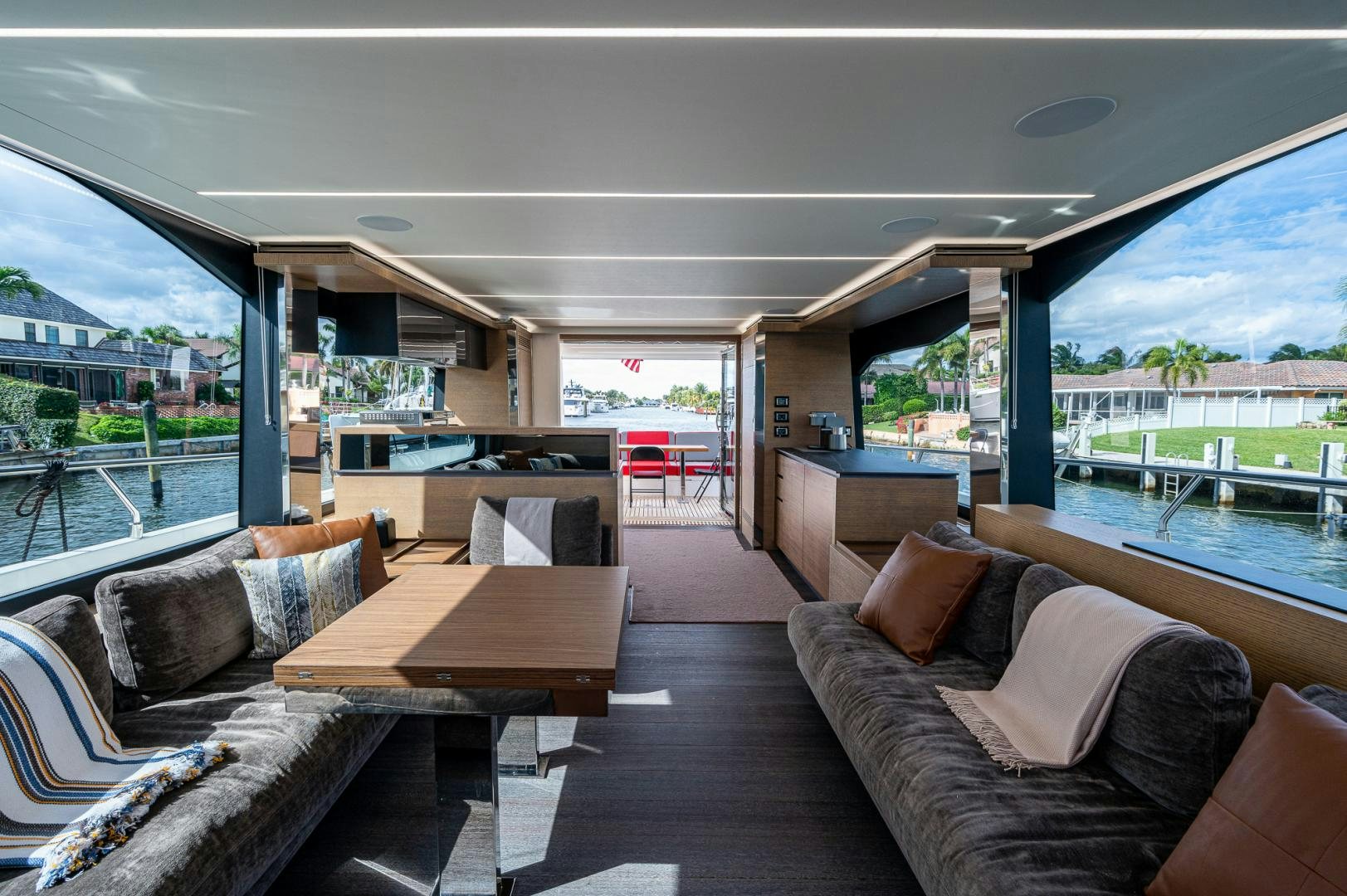 a living room with a large window aboard LEBRADA Yacht for Sale