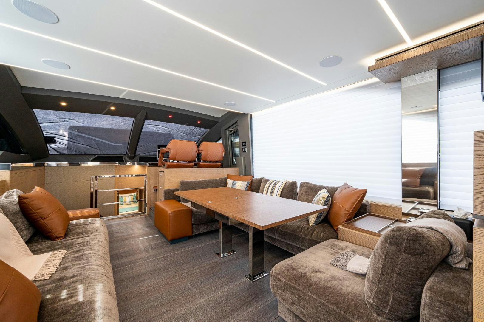 a living room with a couch and a coffee table aboard LEBRADA Yacht for Sale