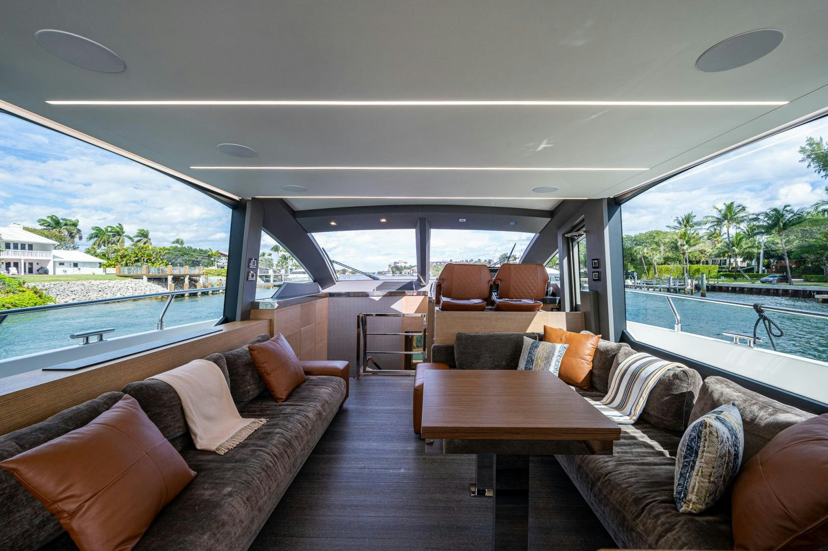 a living room with a large window aboard LEBRADA Yacht for Sale