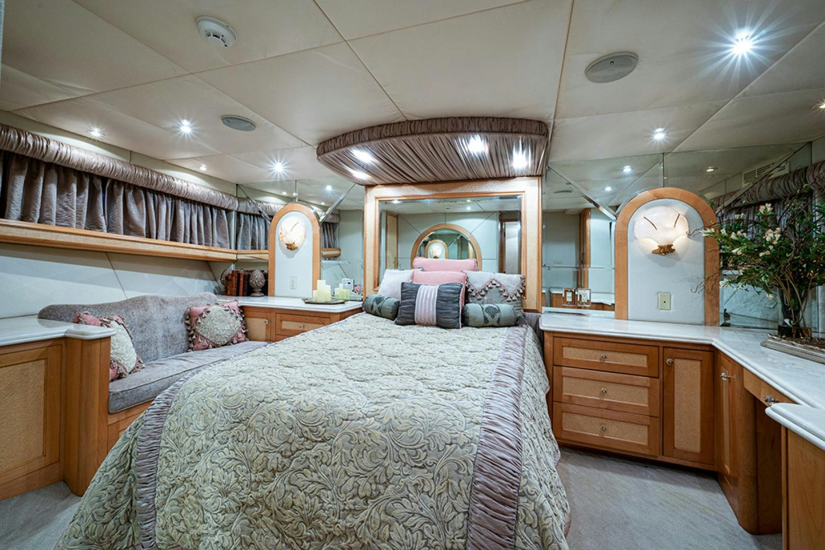 a bedroom with a bed and a mirror aboard CANDY WORLD Yacht for Sale