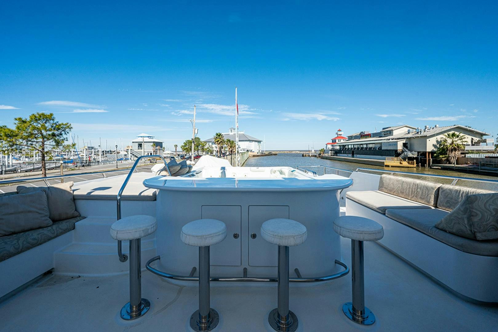 a table with stools on it aboard CANDY WORLD Yacht for Sale