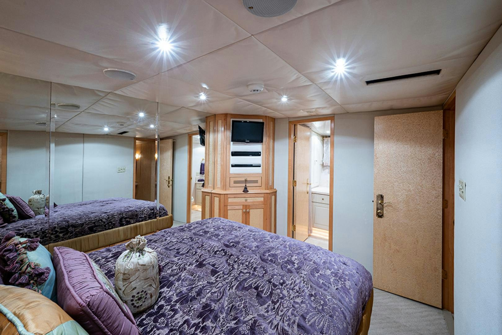 a bedroom with a bed and a door aboard CANDY WORLD Yacht for Sale