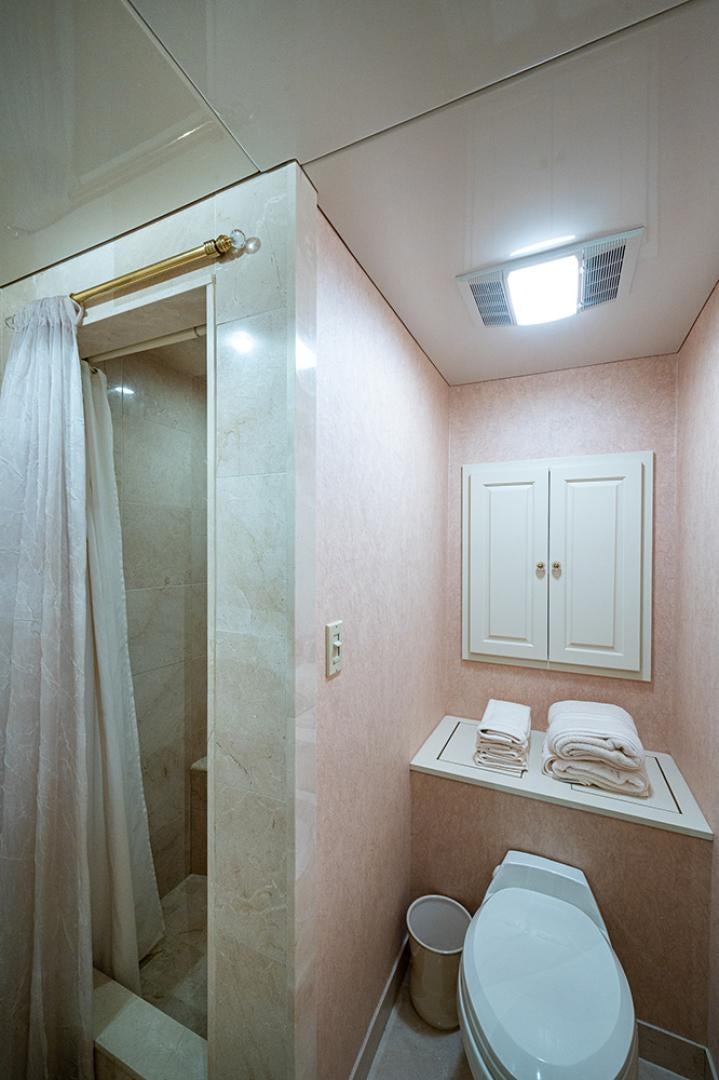 a bathroom with a toilet and a sink aboard CANDY WORLD Yacht for Sale