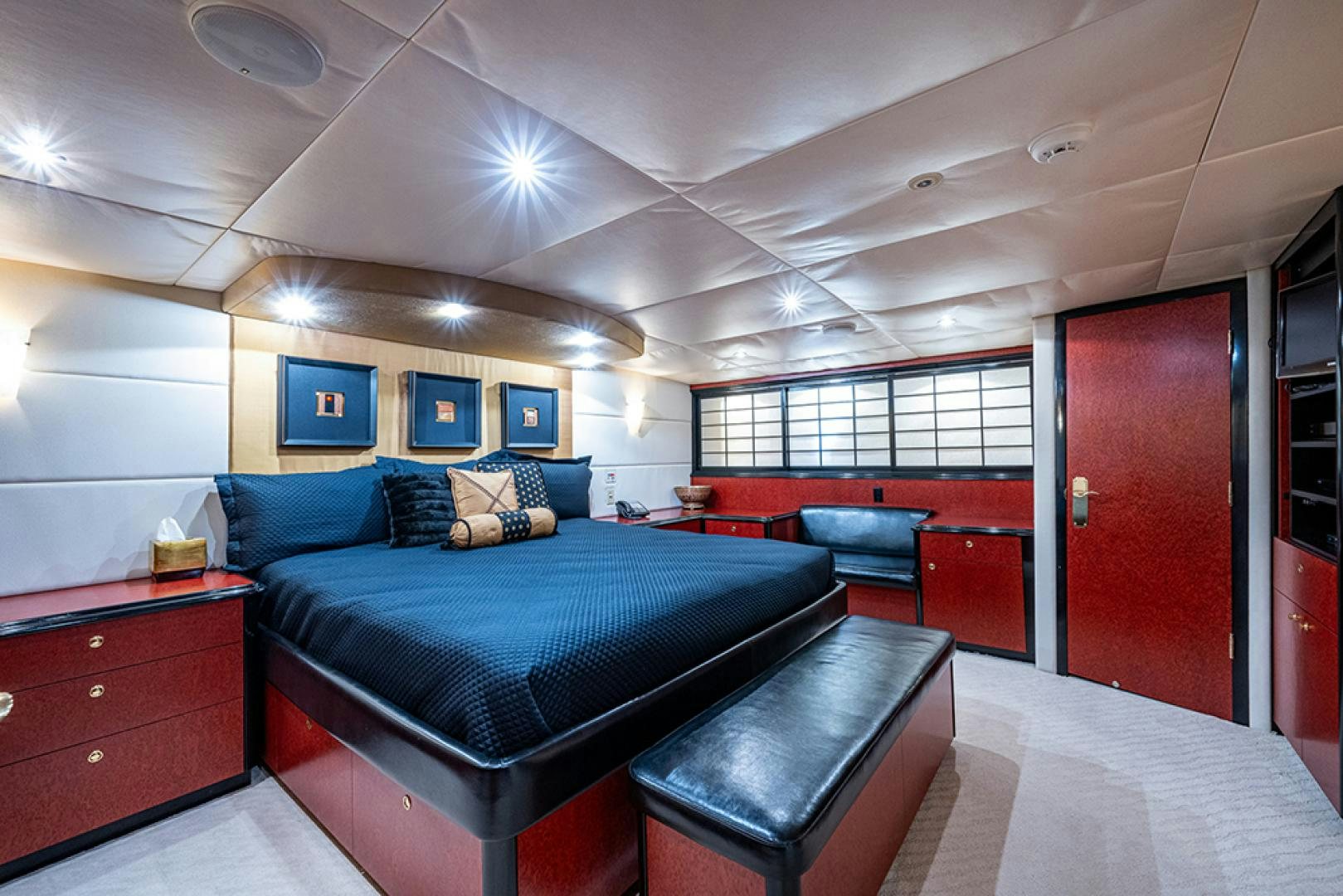 a large bedroom with a bed and a desk aboard CANDY WORLD Yacht for Sale