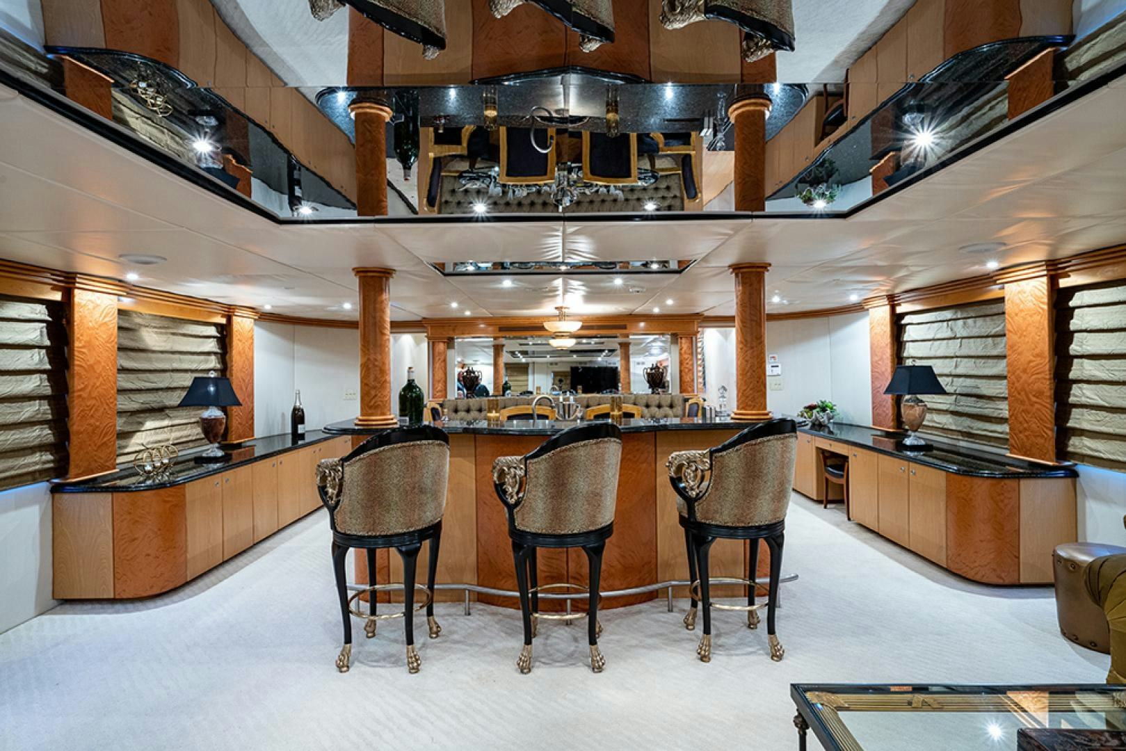 a room with a table chairs and a large window aboard CANDY WORLD Yacht for Sale