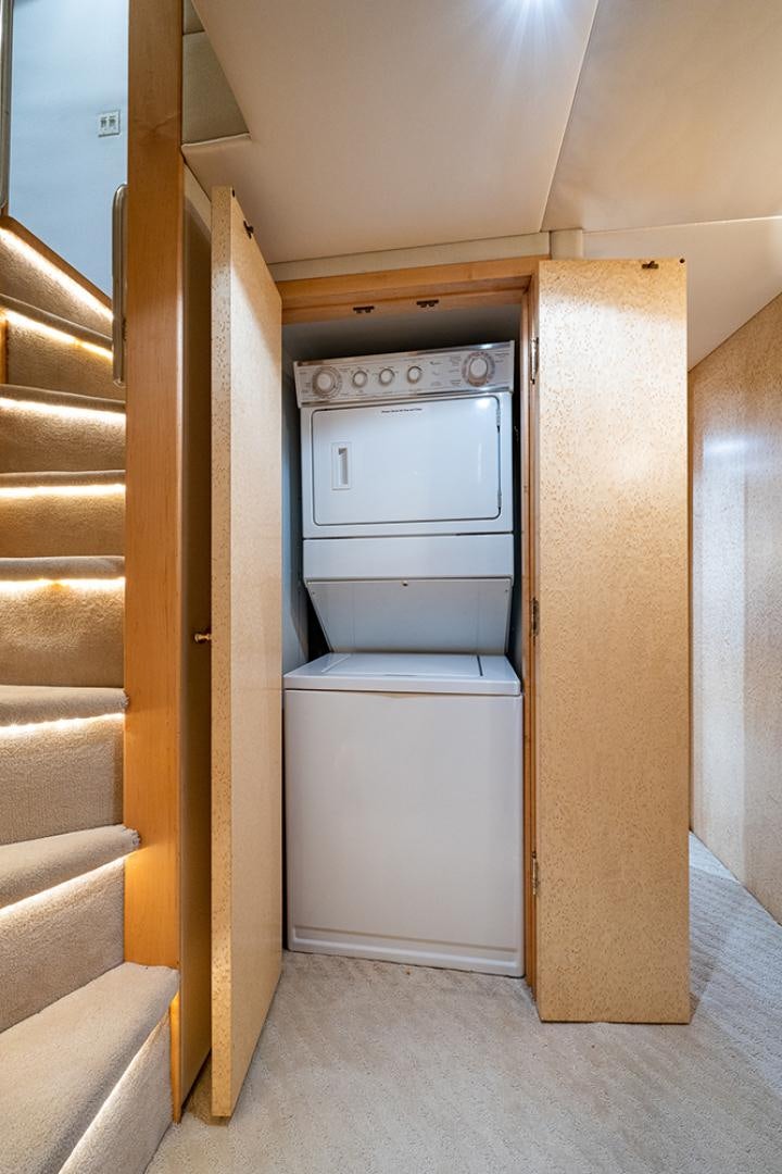 a white cabinet in a room aboard CANDY WORLD Yacht for Sale