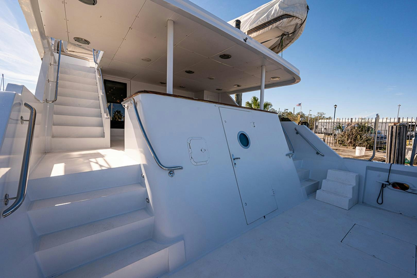 a white boat on a deck aboard CANDY WORLD Yacht for Sale