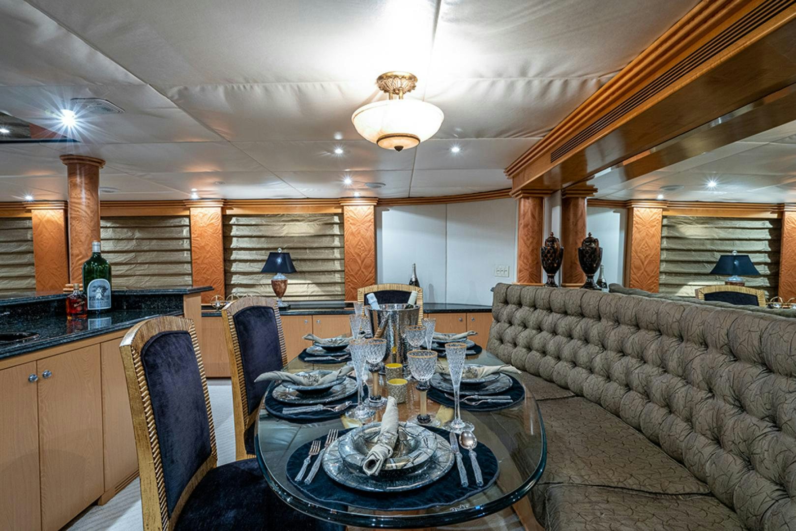a large kitchen with a dining table aboard CANDY WORLD Yacht for Sale
