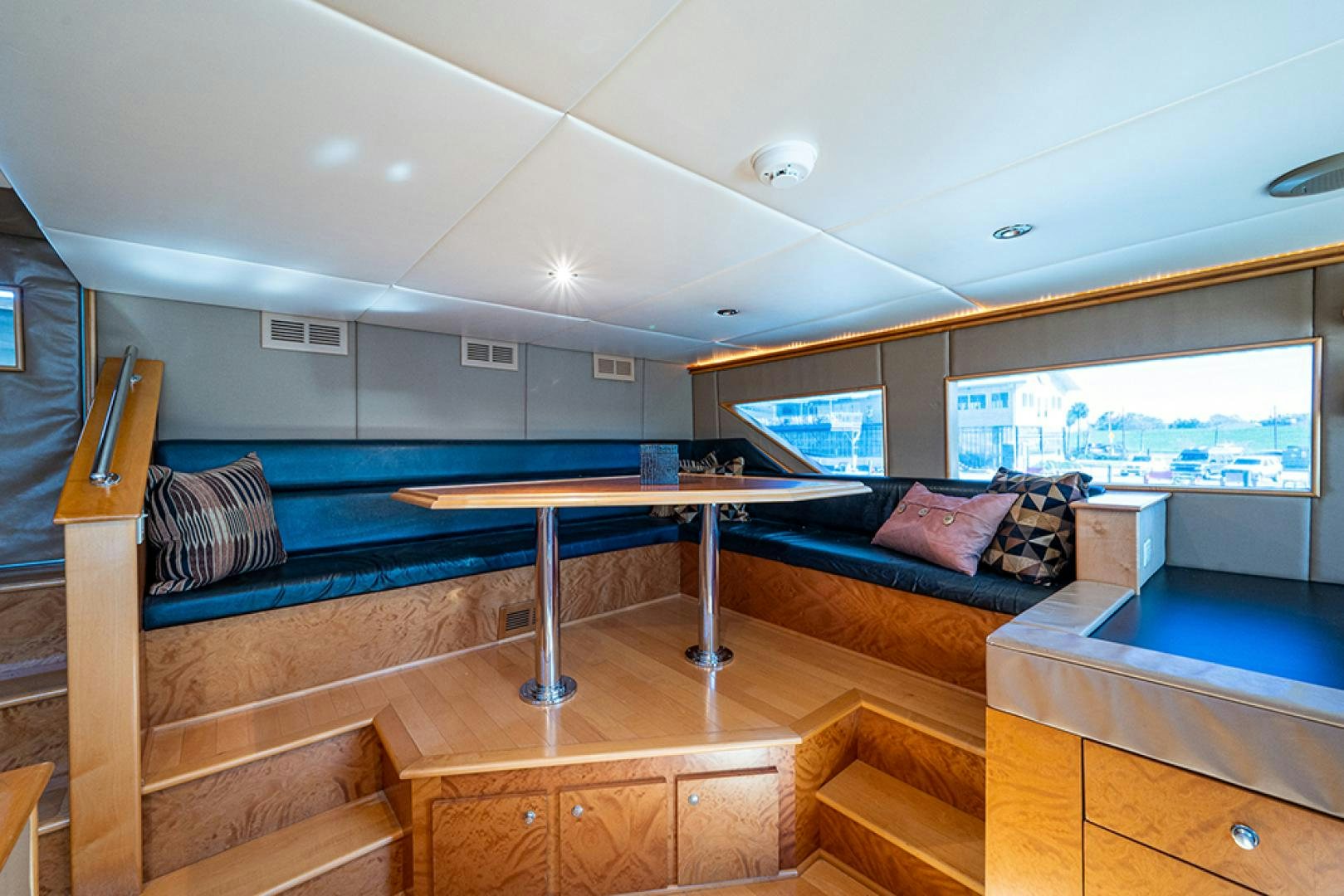 a room with a bed and a table aboard CANDY WORLD Yacht for Sale