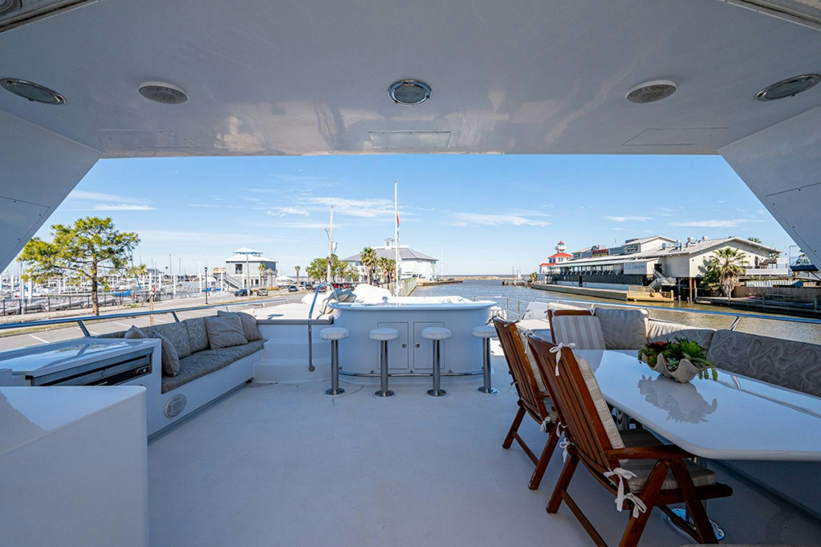 a room with tables and chairs aboard CANDY WORLD Yacht for Sale