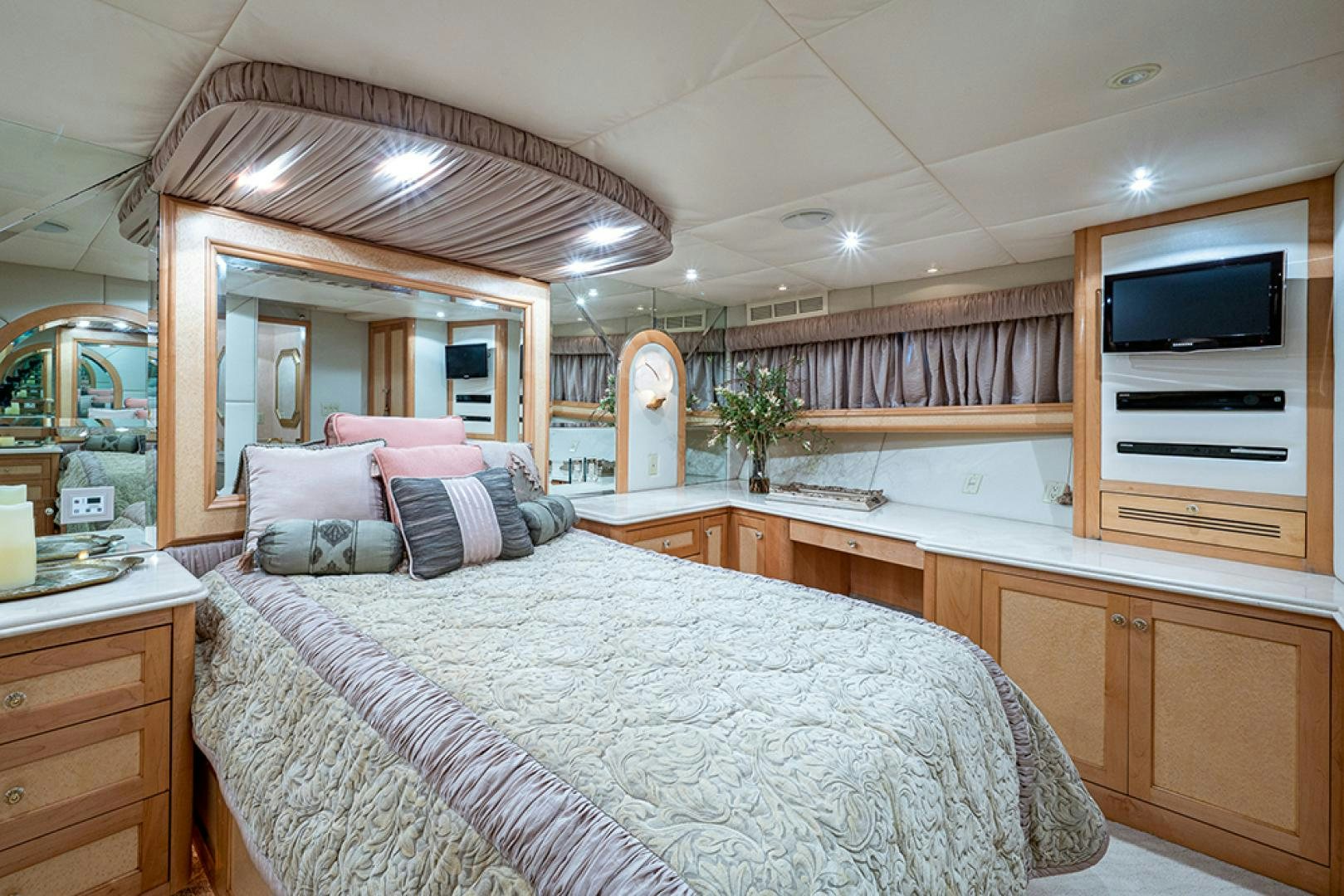 a bedroom with a bed and a television aboard CANDY WORLD Yacht for Sale