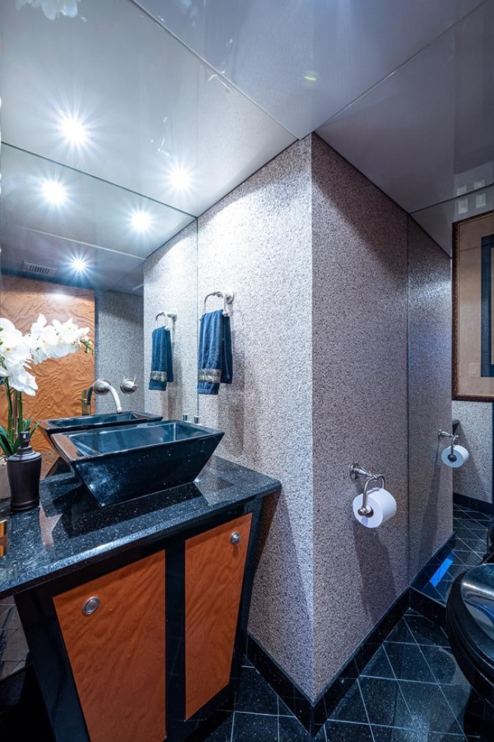 a bathroom with a sink and a mirror aboard CANDY WORLD Yacht for Sale