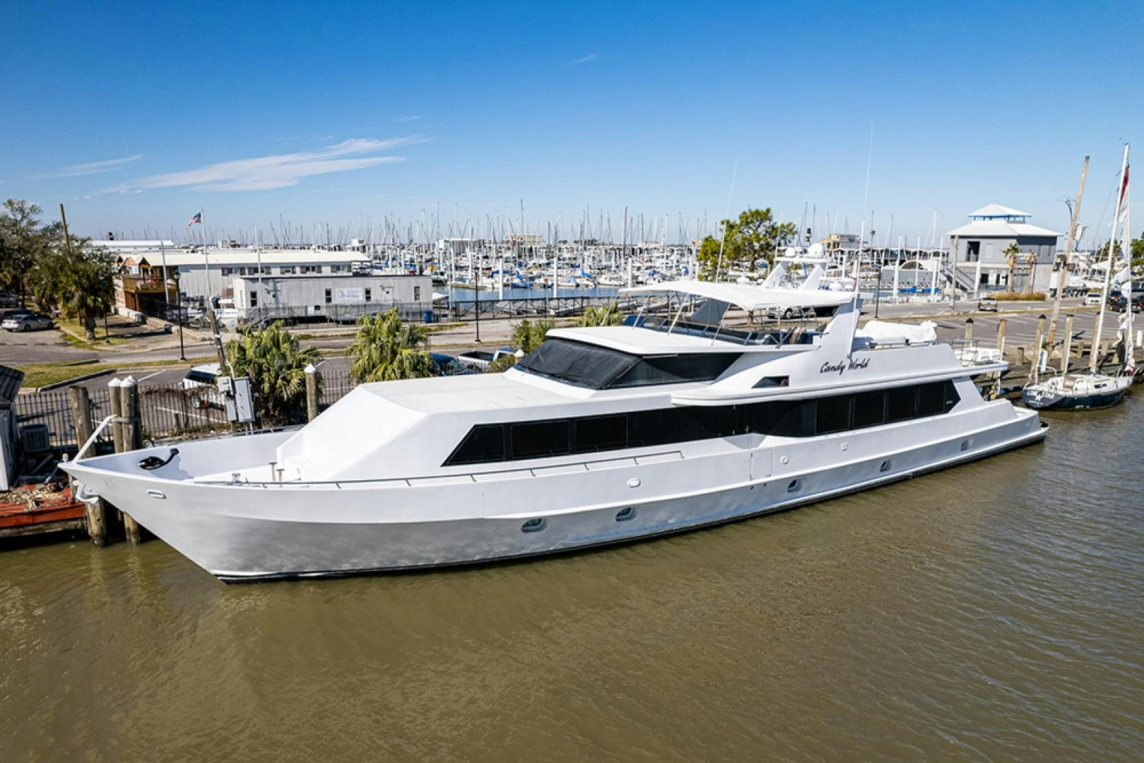 a yacht docked at a pier aboard CANDY WORLD Yacht for Sale