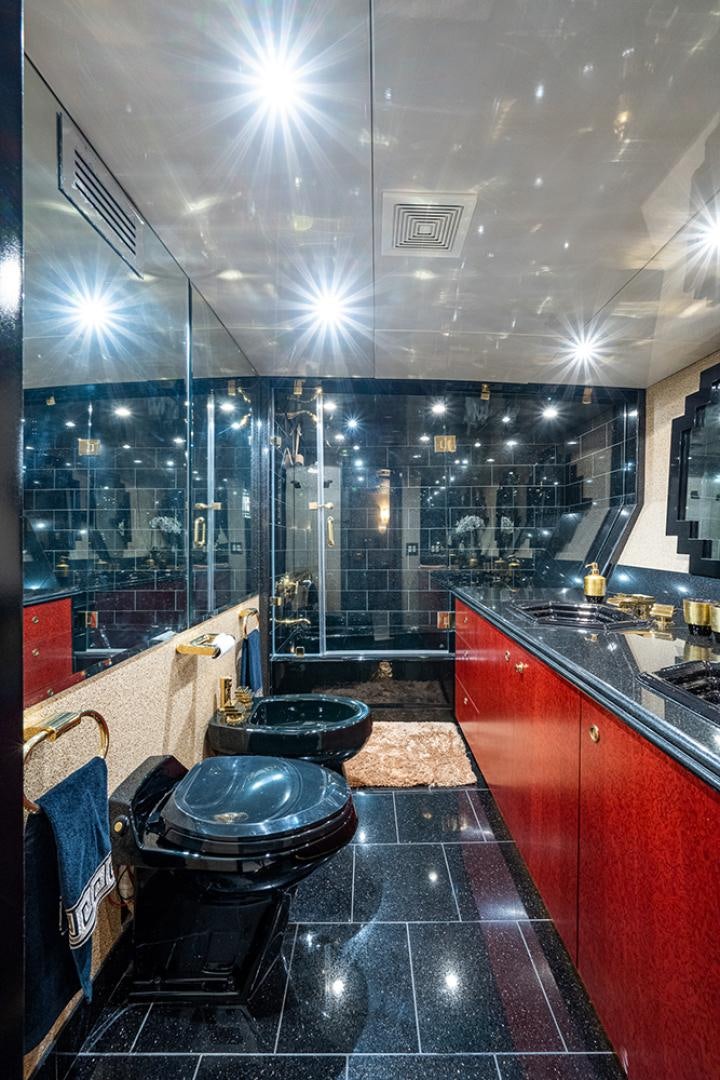 a bathroom with red cabinets aboard CANDY WORLD Yacht for Sale