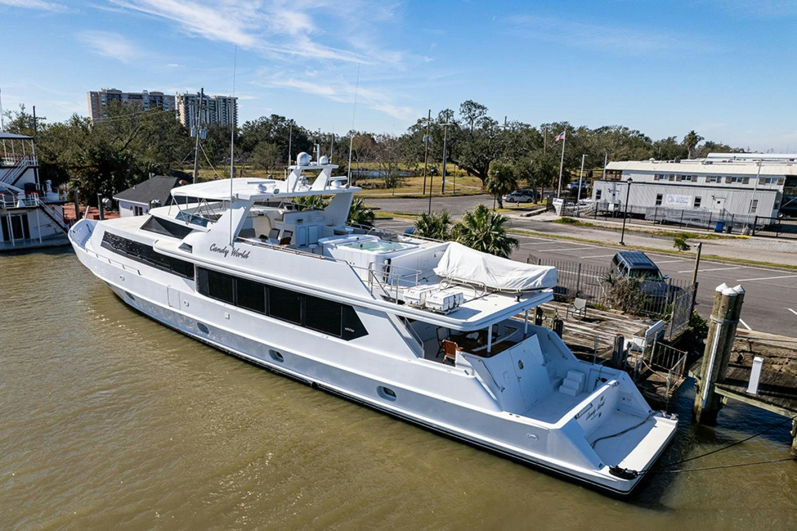 a boat docked in a harbor aboard CANDY WORLD Yacht for Sale