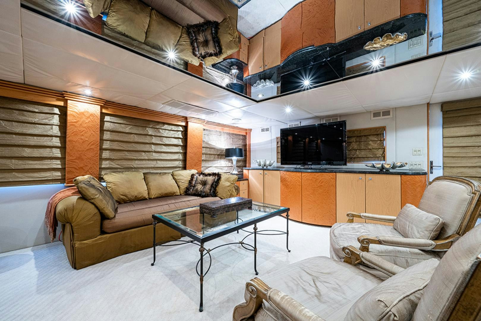a living room with a couch and a coffee table aboard CANDY WORLD Yacht for Sale