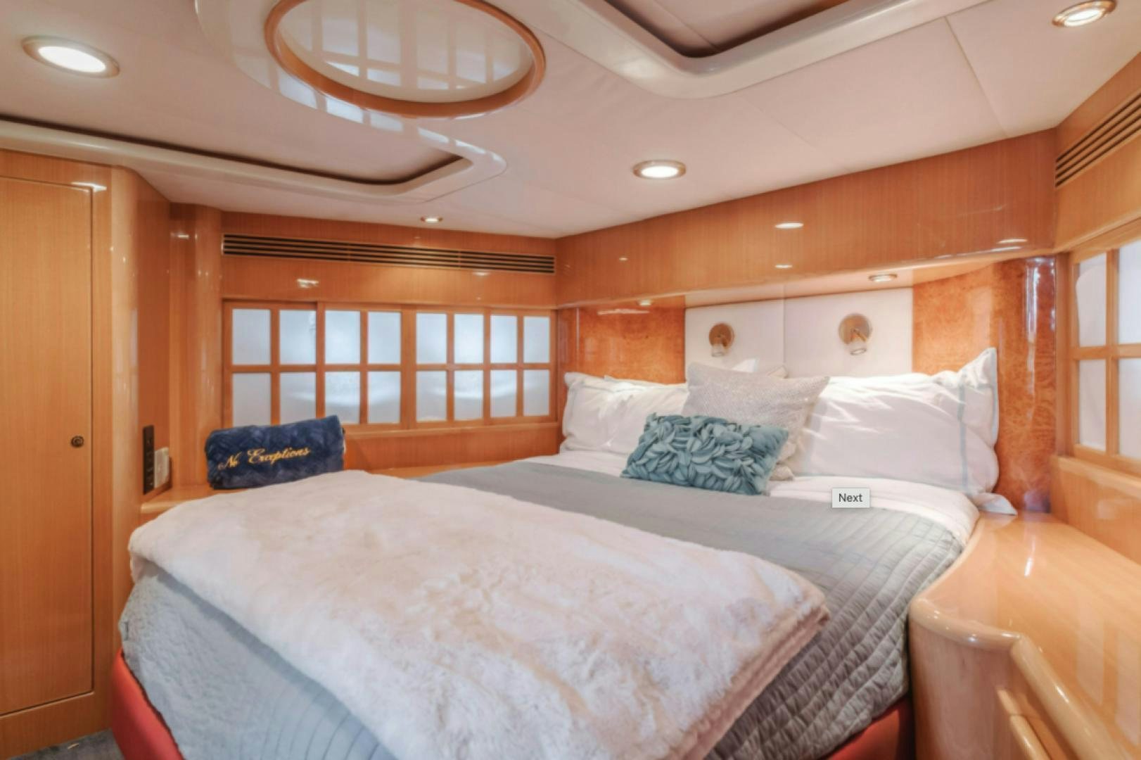 a large bed in a room aboard no exceptions Yacht for Sale