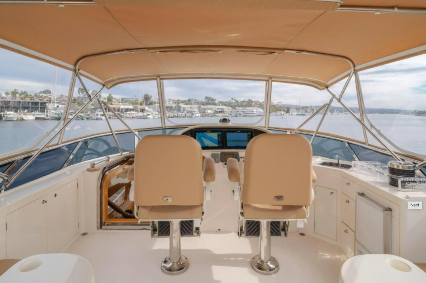 a boat with chairs and a table aboard no exceptions Yacht for Sale