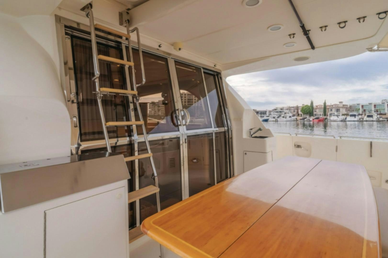 a room with a table and a ladder aboard no exceptions Yacht for Sale