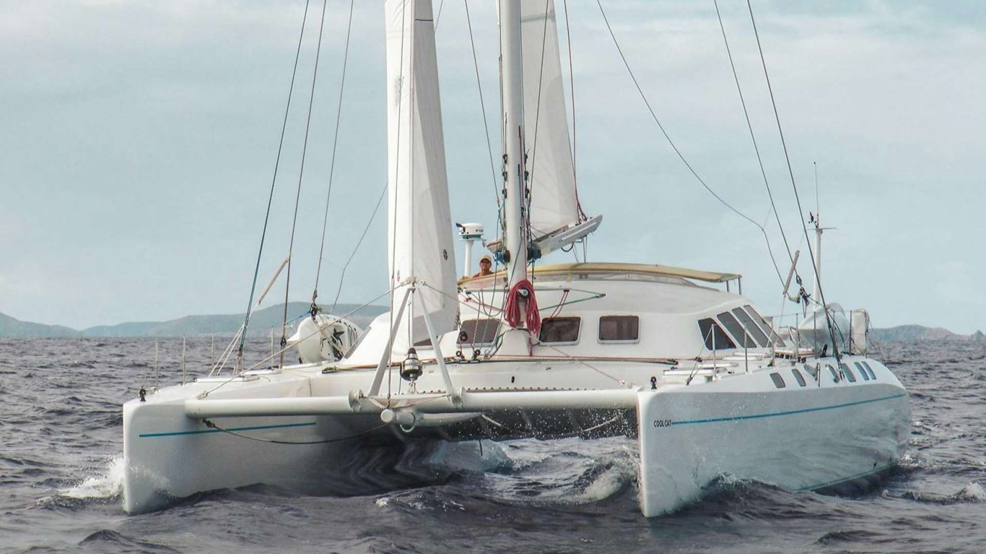 a white boat in the water aboard COOL CAT 1 Yacht for Sale