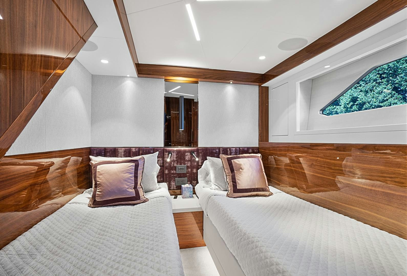 a room with two beds aboard YOUNG HEARTS Yacht for Sale