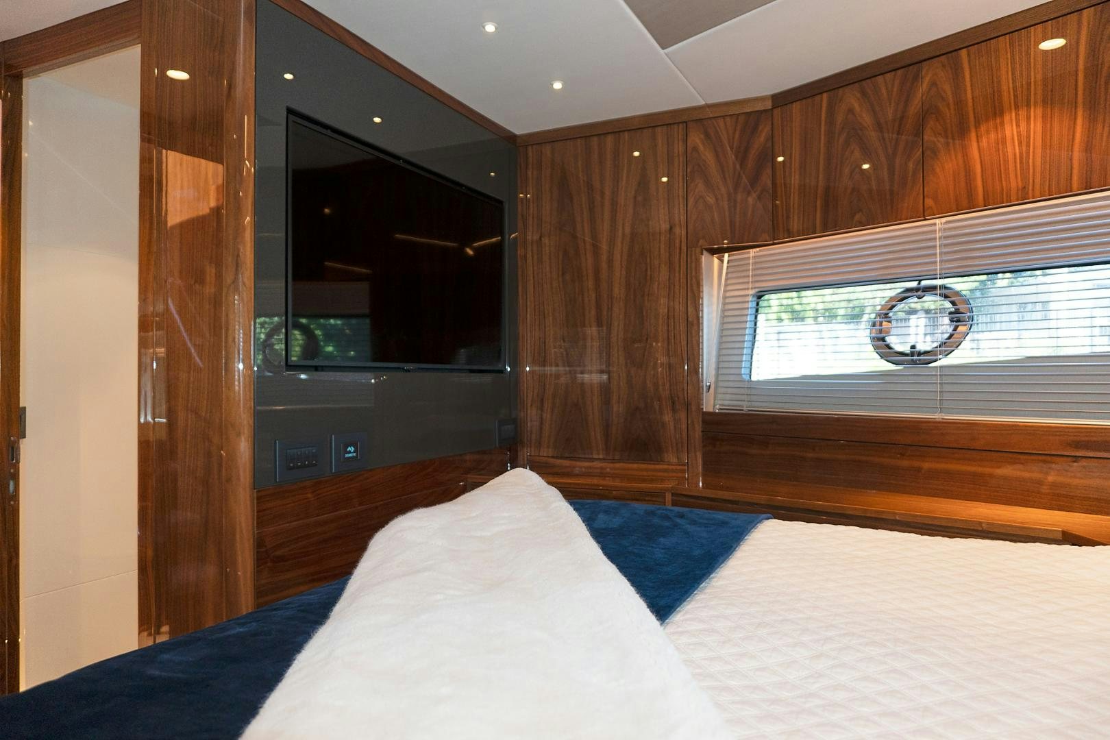 a bed in a room aboard YOUNG HEARTS Yacht for Sale