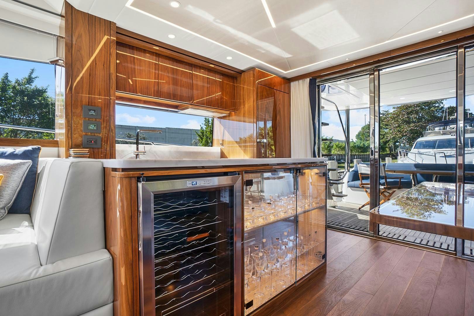 a living room with a fireplace aboard YOUNG HEARTS Yacht for Sale