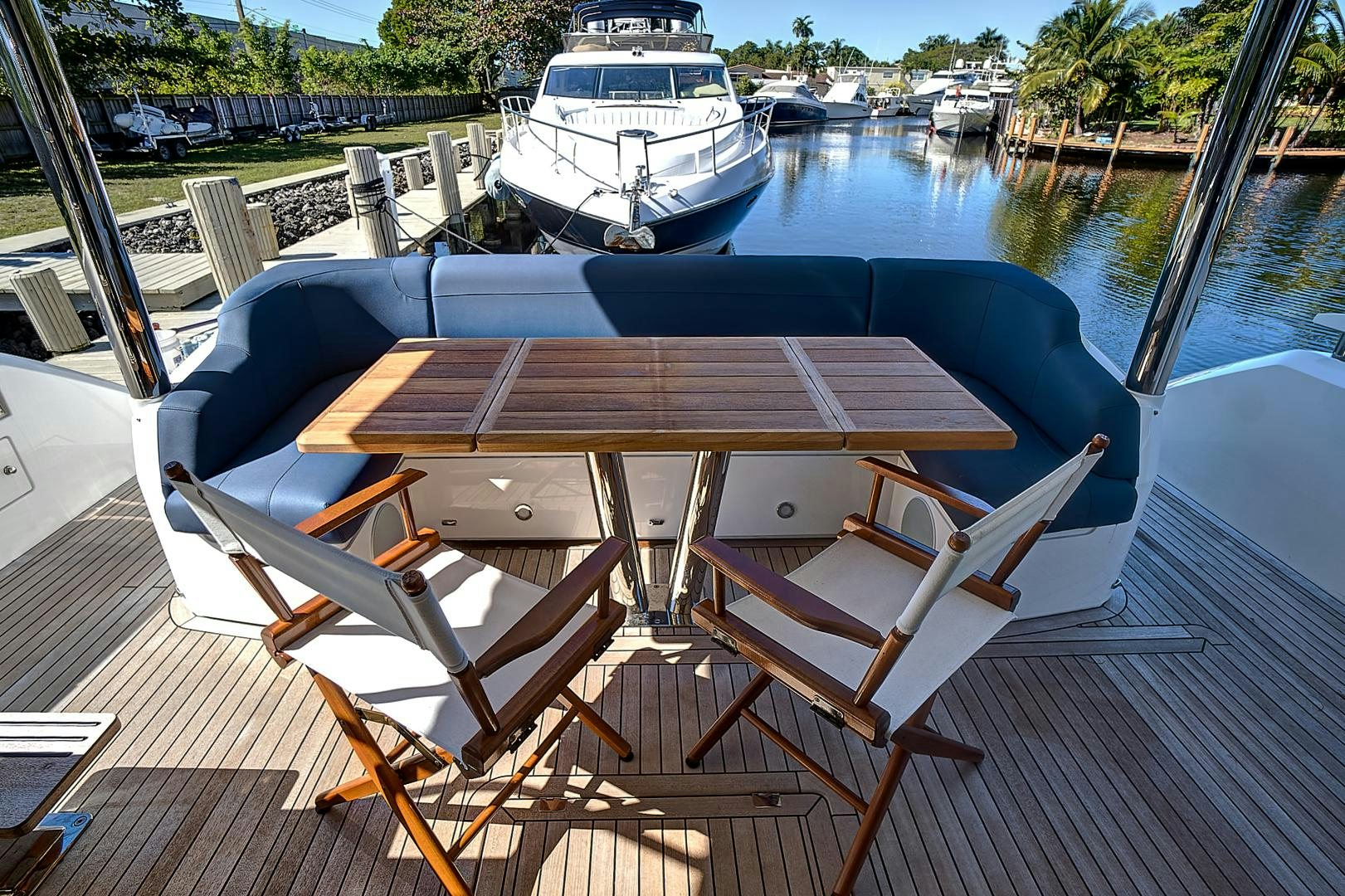 a table and chairs on a deck aboard YOUNG HEARTS Yacht for Sale