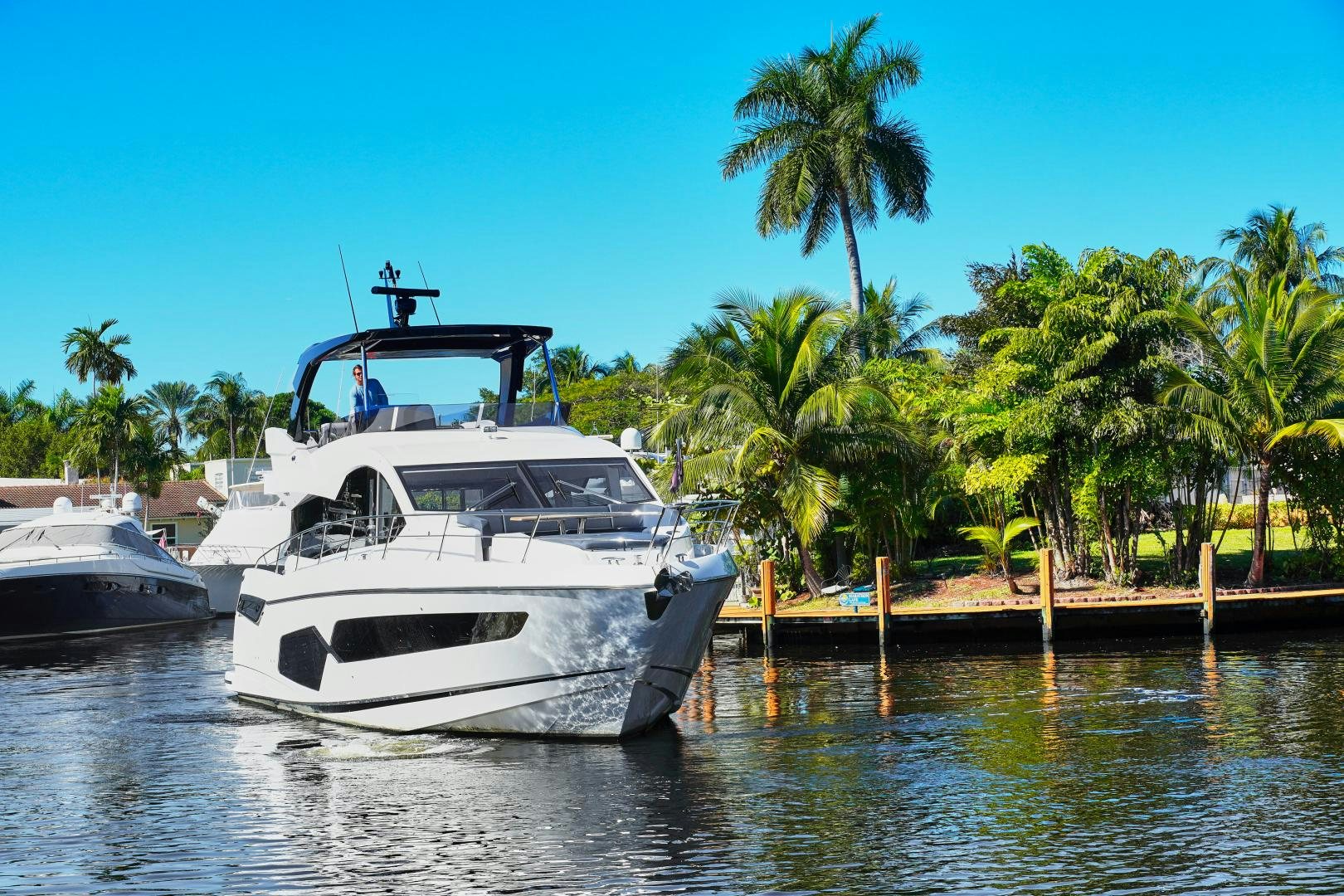 a couple of boats are parked at a dock aboard YOUNG HEARTS Yacht for Sale