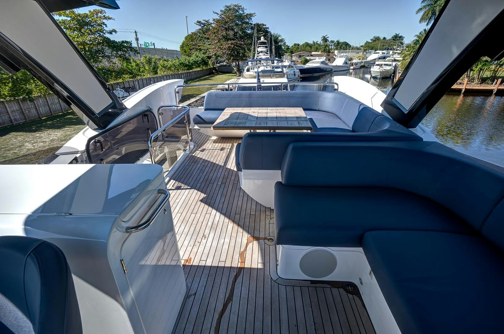 a deck with a deck and chairs aboard YOUNG HEARTS Yacht for Sale