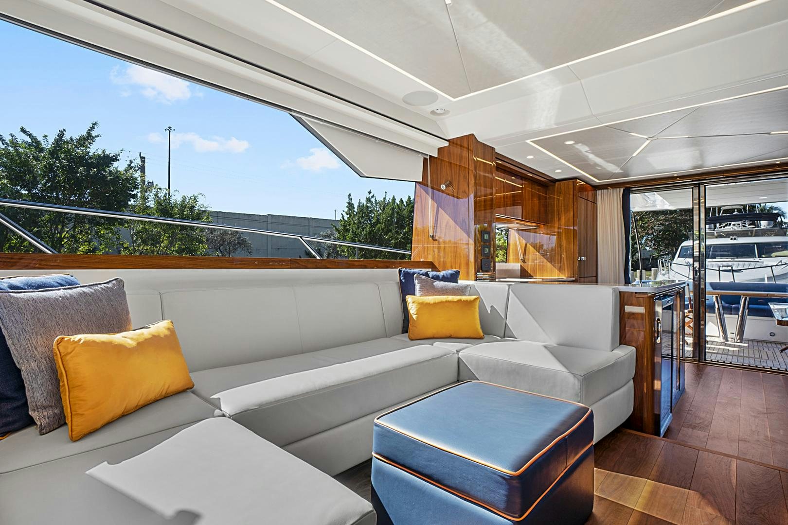 a living room with a large window aboard YOUNG HEARTS Yacht for Sale