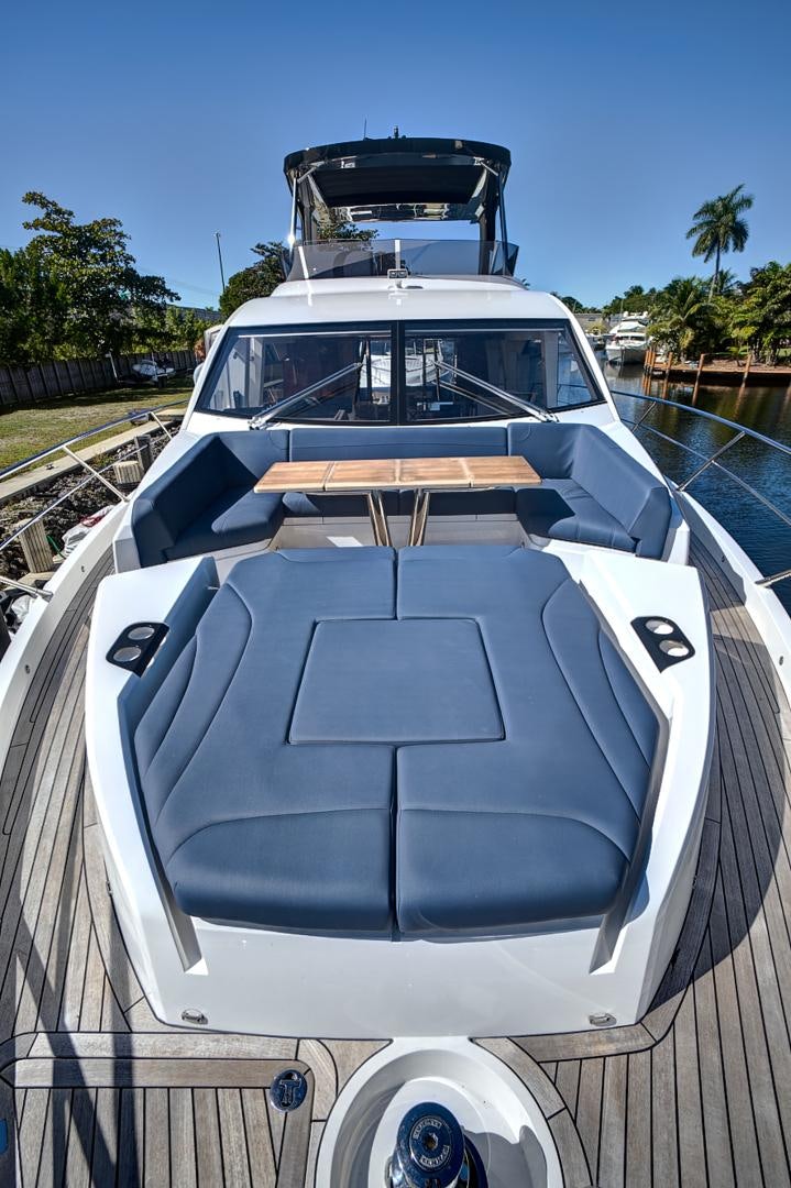 a white car with a large engine aboard YOUNG HEARTS Yacht for Sale