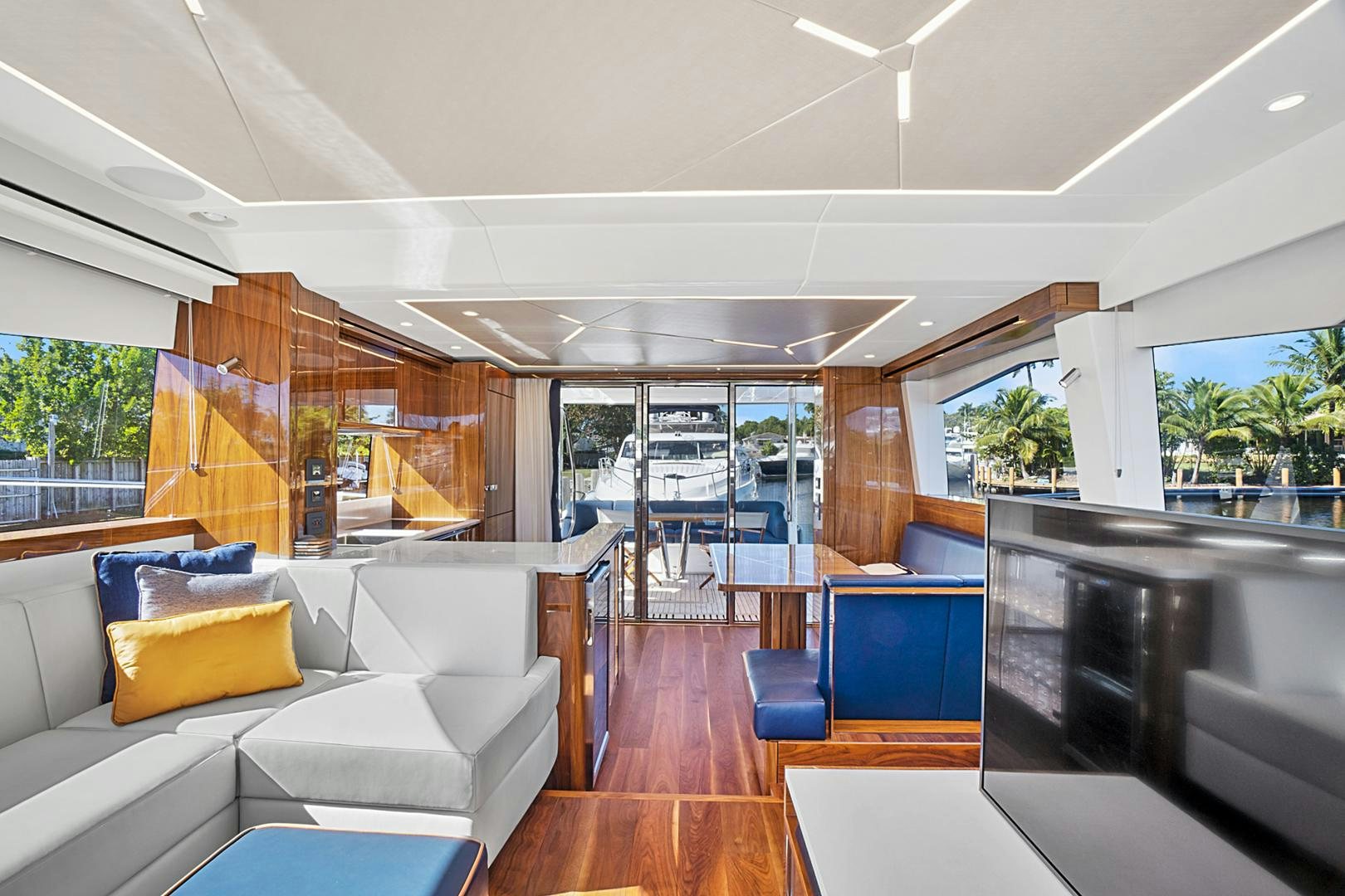 a living room with a large glass window aboard YOUNG HEARTS Yacht for Sale