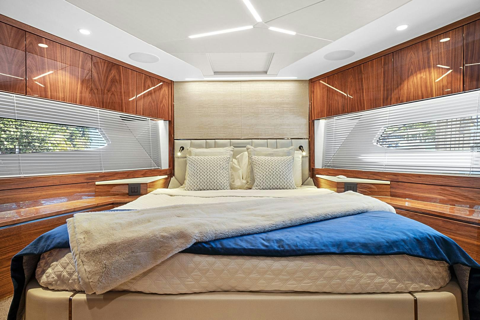 a bedroom with wood walls aboard YOUNG HEARTS Yacht for Sale