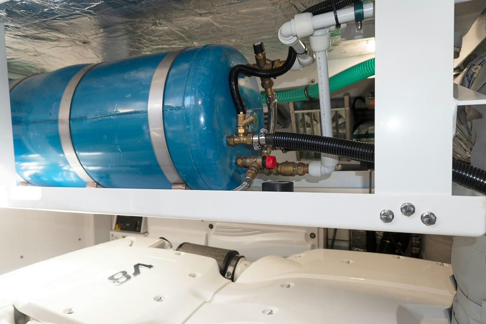 a machine with blue pipes aboard YOUNG HEARTS Yacht for Sale