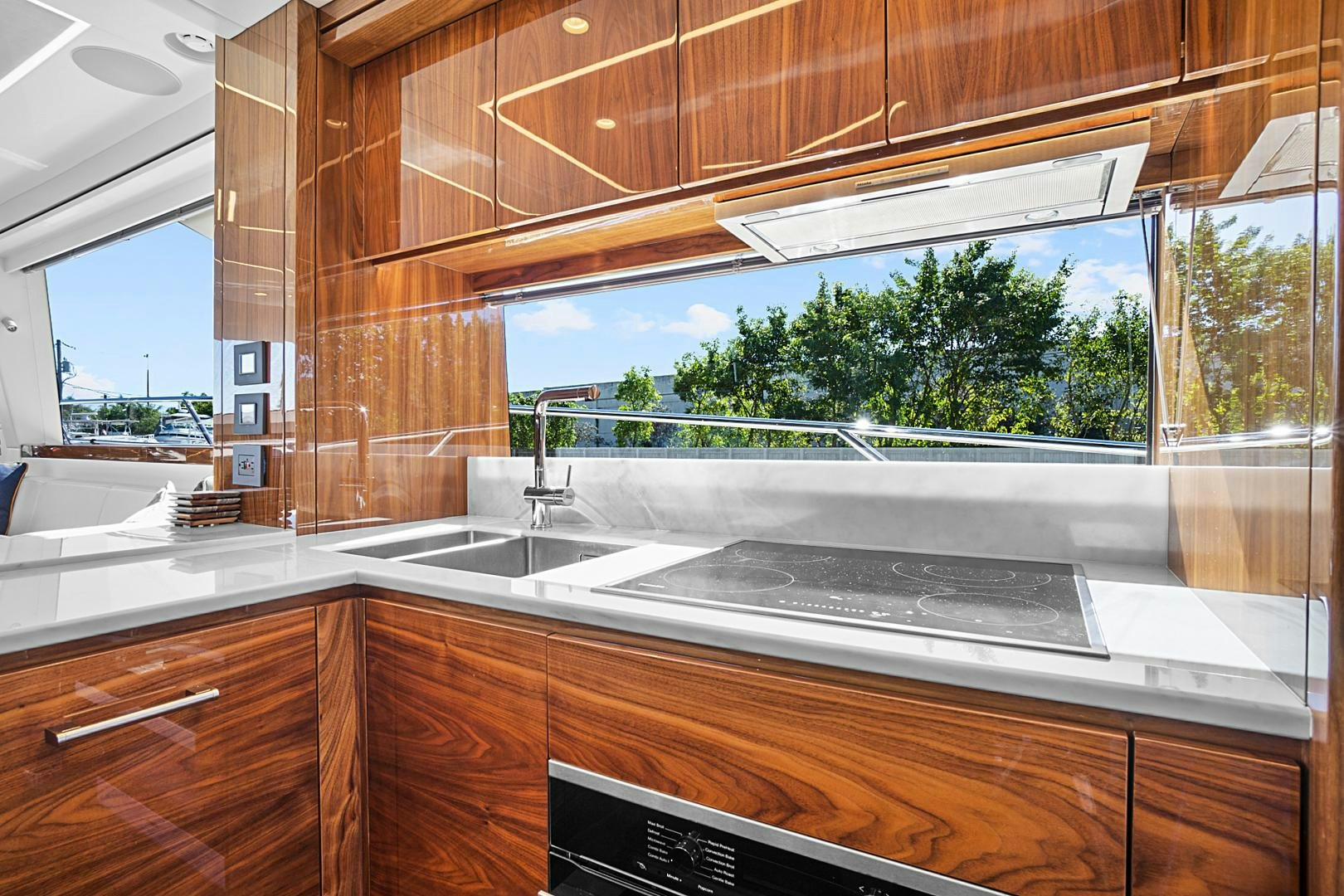 a kitchen with a large window aboard YOUNG HEARTS Yacht for Sale