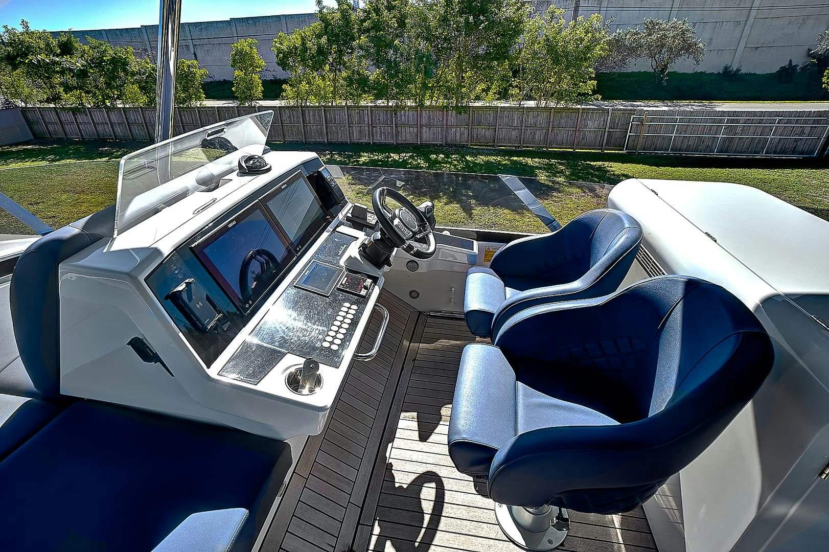 a car with a steering wheel aboard YOUNG HEARTS Yacht for Sale