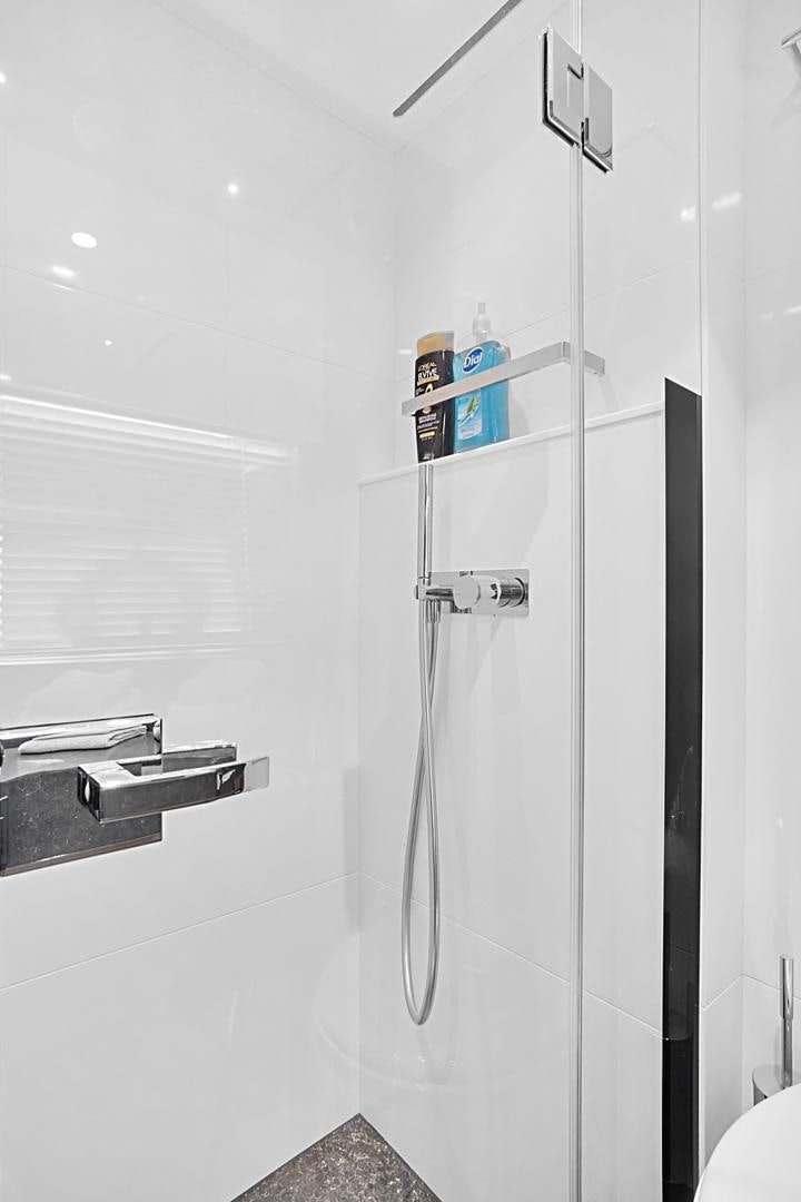 a shower unit in a bathroom aboard YOUNG HEARTS Yacht for Sale