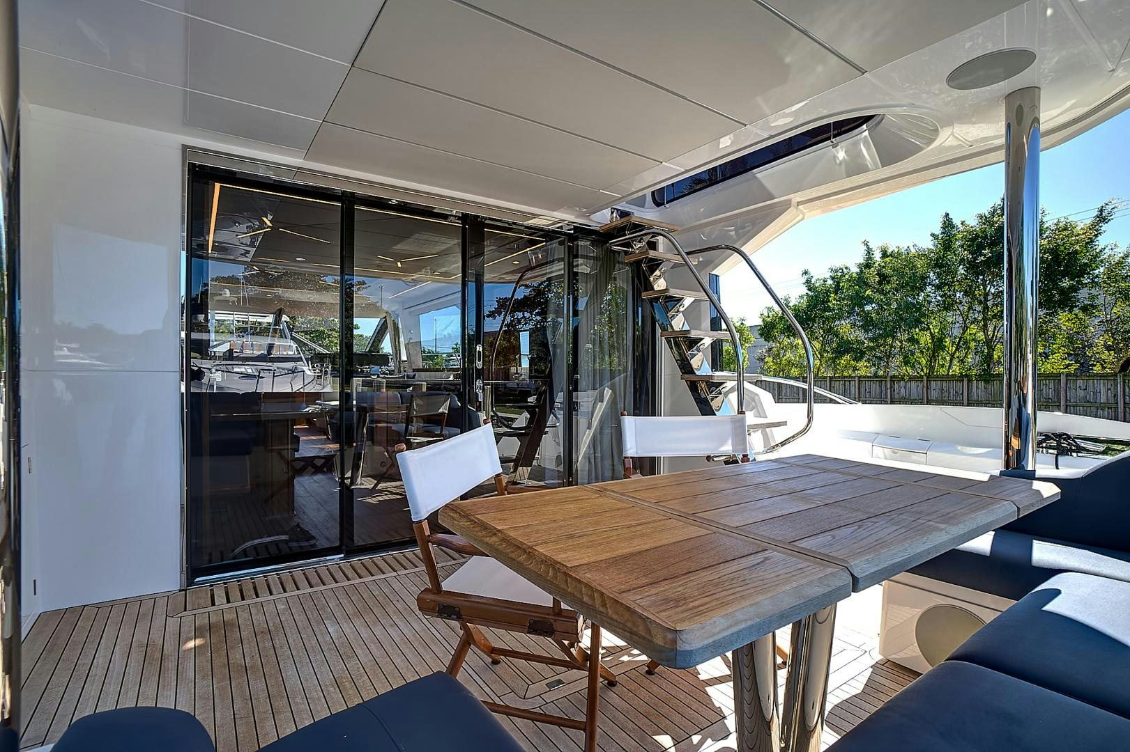a wood table on a boat aboard YOUNG HEARTS Yacht for Sale
