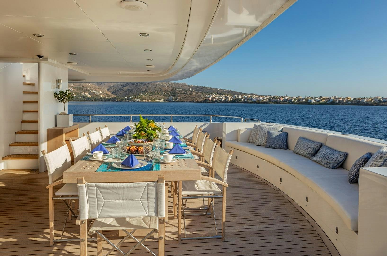 a patio with a table and chairs aboard ZALIV III Yacht for Sale