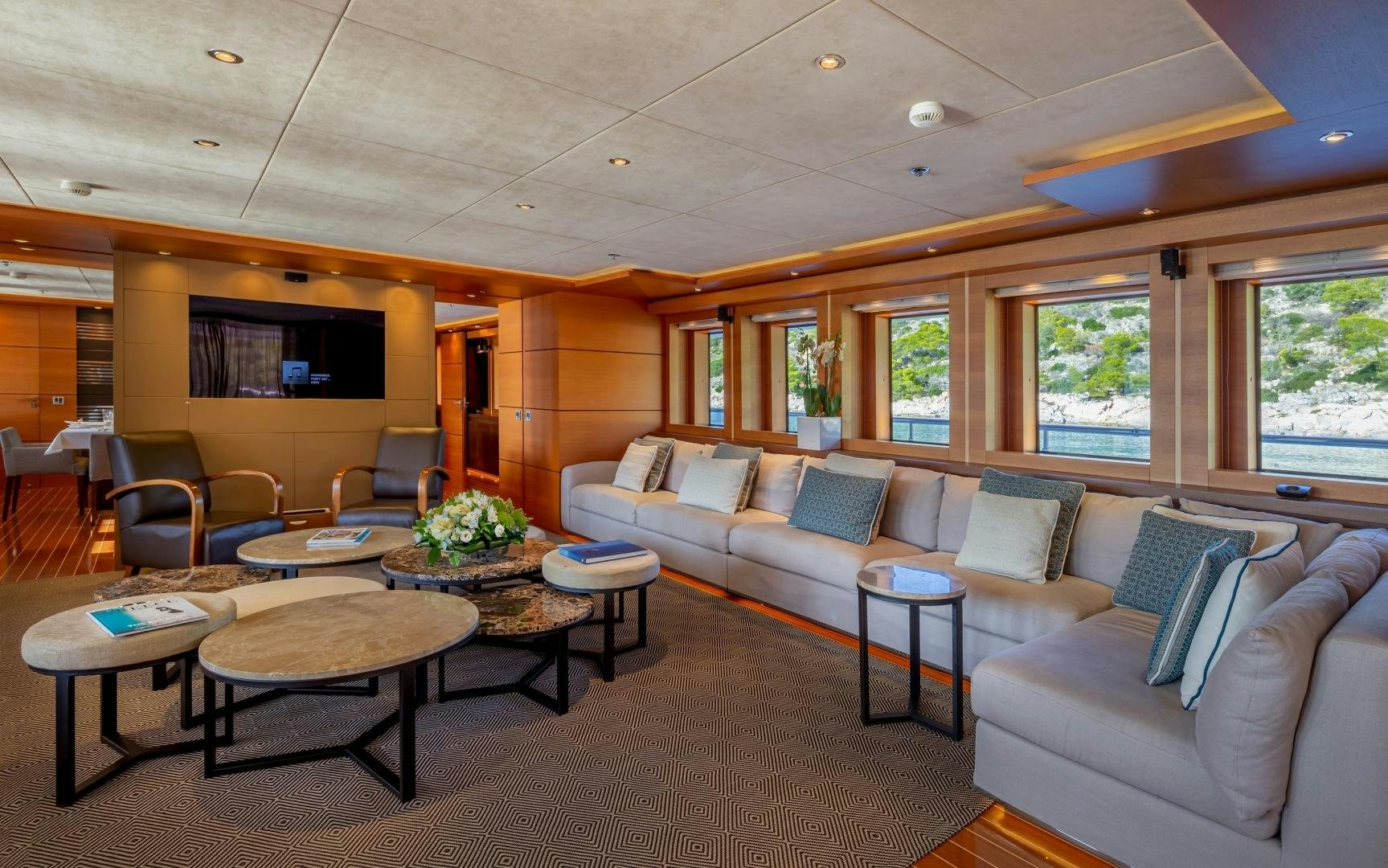 a living room with a couch and a table aboard ZALIV III Yacht for Sale