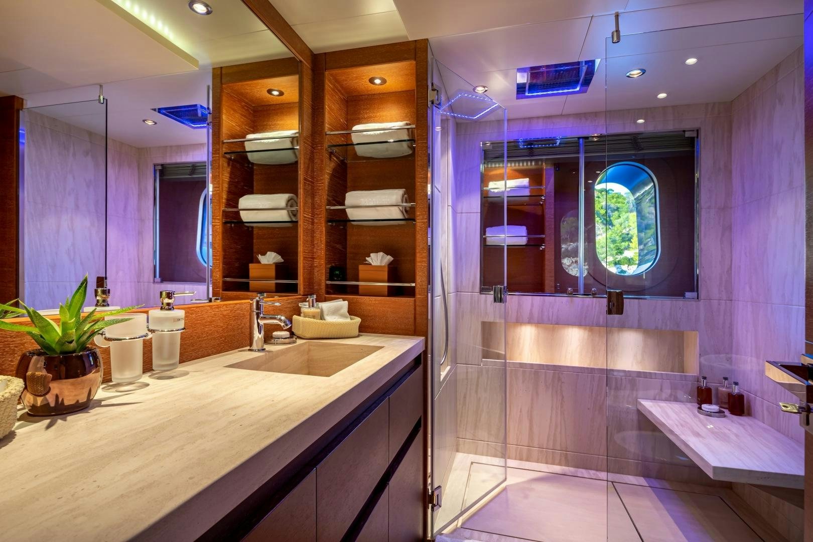 a bathroom with a countertop sinks and a large mirror aboard ZALIV III Yacht for Sale