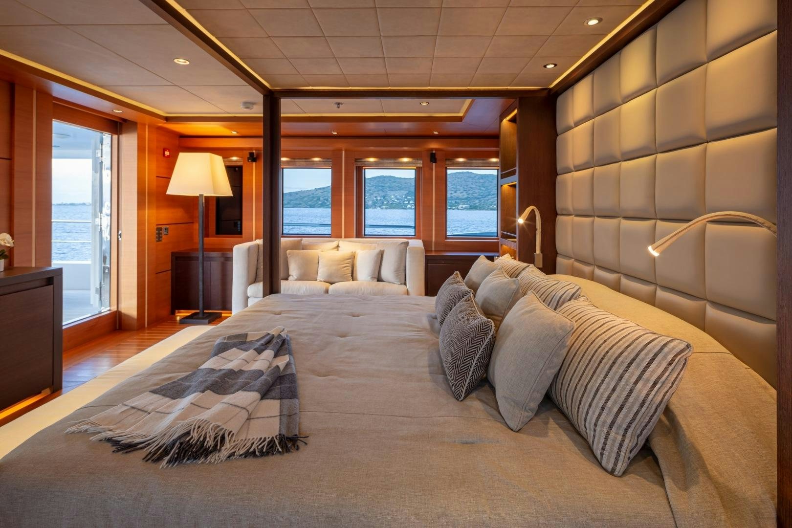 a large hotel room with a large bed and a tv aboard ZALIV III Yacht for Sale