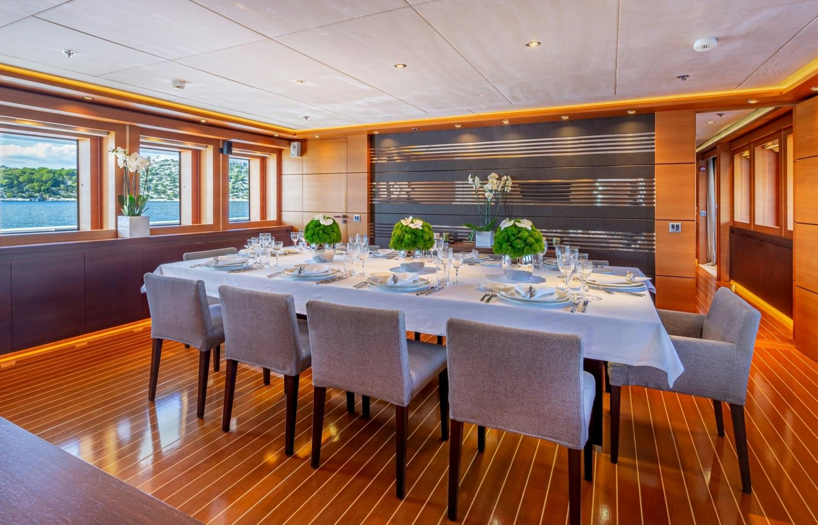 a large dining room table aboard ZALIV III Yacht for Sale