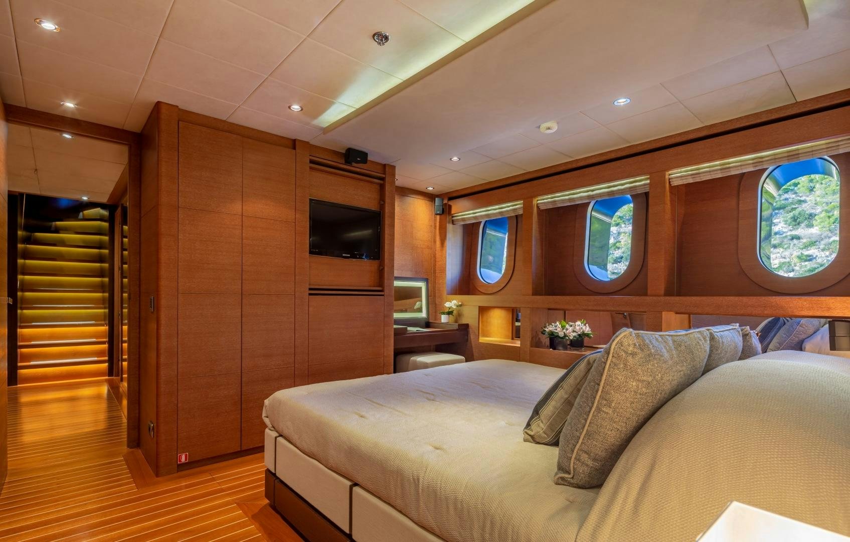 a room with a bed and a television aboard ZALIV III Yacht for Sale